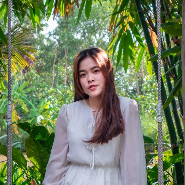 Alex Chen, Lead Design Curator at Calm River Connection, reviewing corporate floral arrangements